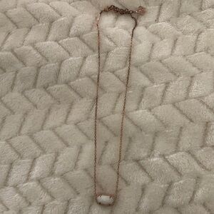 Kendra Scott necklace.